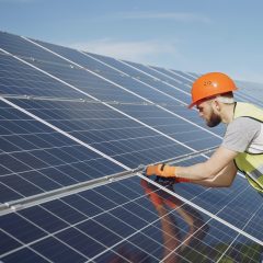 young-engineer-checking-maintenance-of-solar-panels-4254168